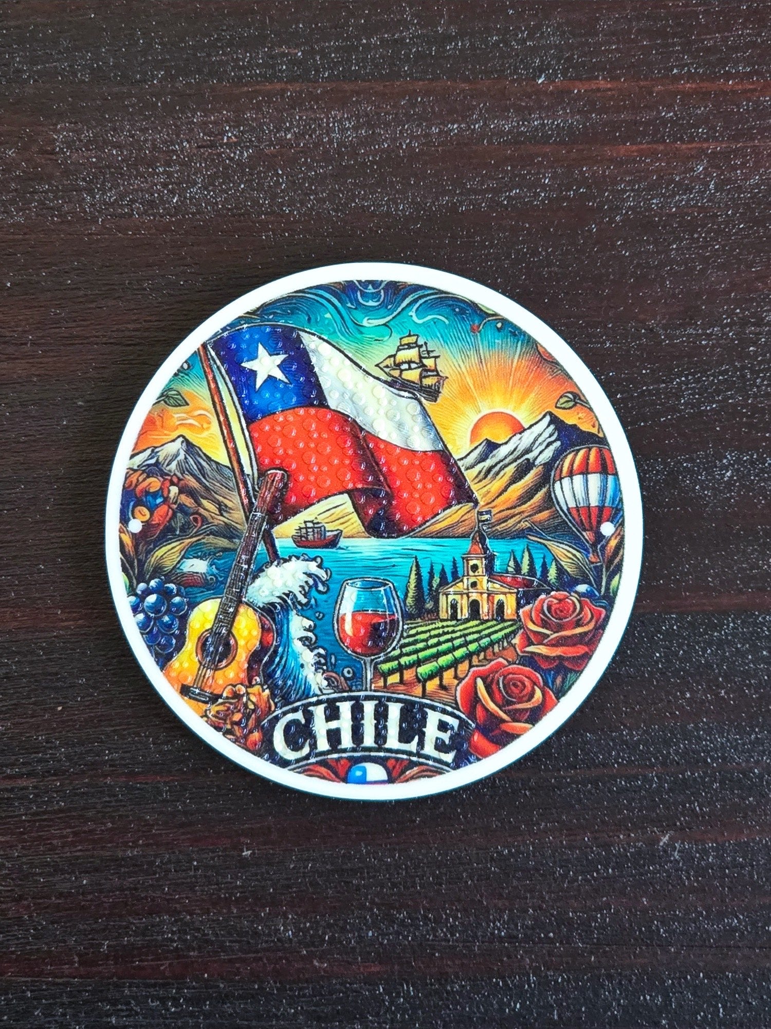 Imán circular con una escena de Chile y la bandera al centro