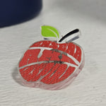 Pin de manzana roja con hoja verde, fondo transparente